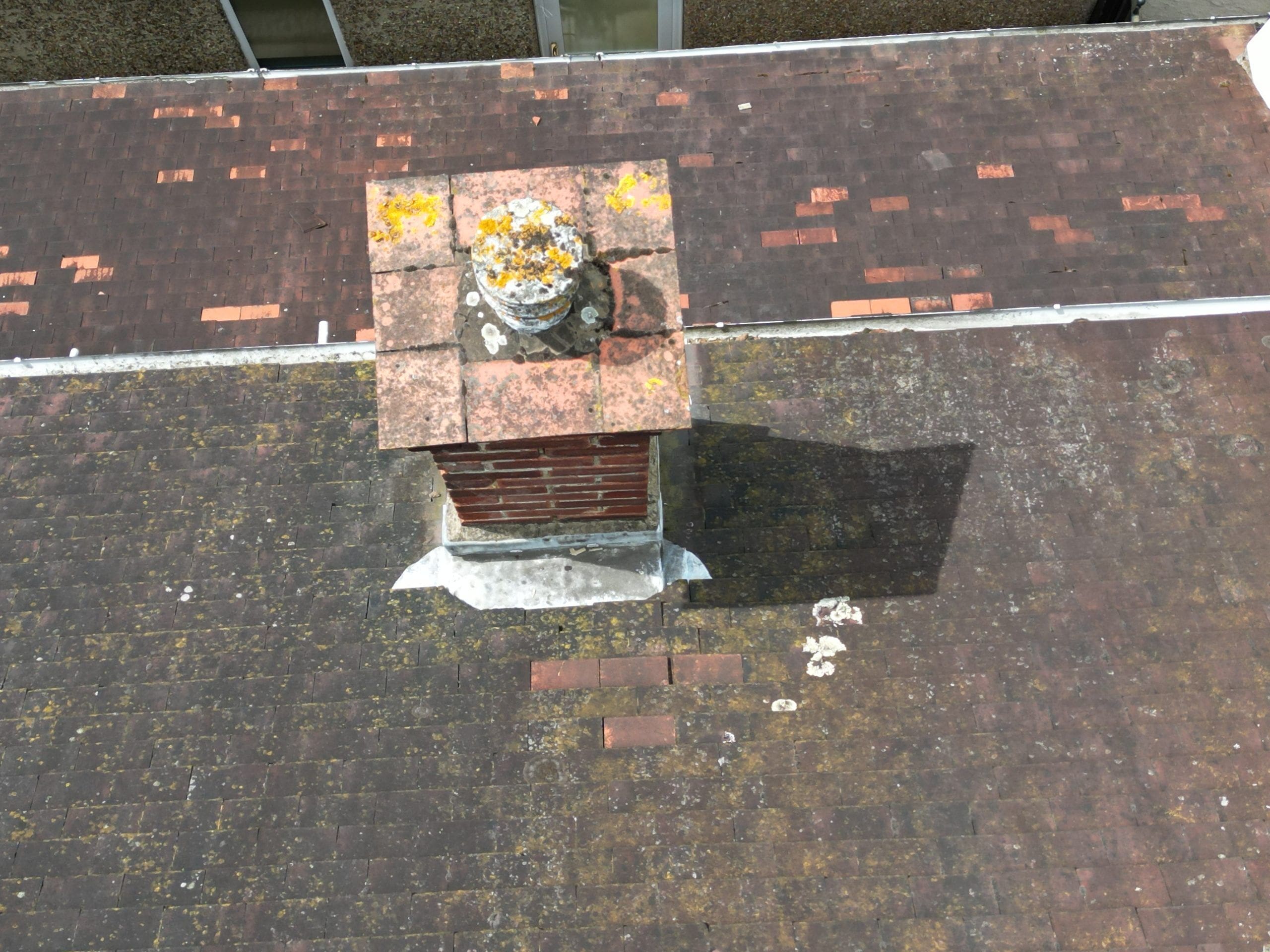 Roof survey image of a semi detached house with defective tiles.