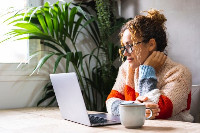 Nice lady searching flettons.com for a quote on her laptop
